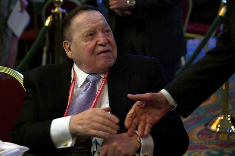 LAS VEGAS, NV - FEBRUARY 24: Las Vegas Sands Corp. Chairman and CEO Sheldon Adelson is greeted by a guest before a speech by U.S. Vice President Mike Pence (not pictured) at the Republican Jewish Coalition's annual leadership meeting at The Venetian Las Vegas on February 24, 2017 in Las Vegas, Nevada. Pence's speech to the group of Republican Jewish leaders and donors follows his trip last week to Germany where he visited the former Dachau concentration camp and a surprise stop on Wednesday at a Jewish cemetery in Missouri that had been vandalized. (Photo by Ethan Miller/Getty Images)